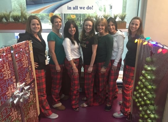 The SpecialEyes team shows their Christmas spirit in matching pajama pants.